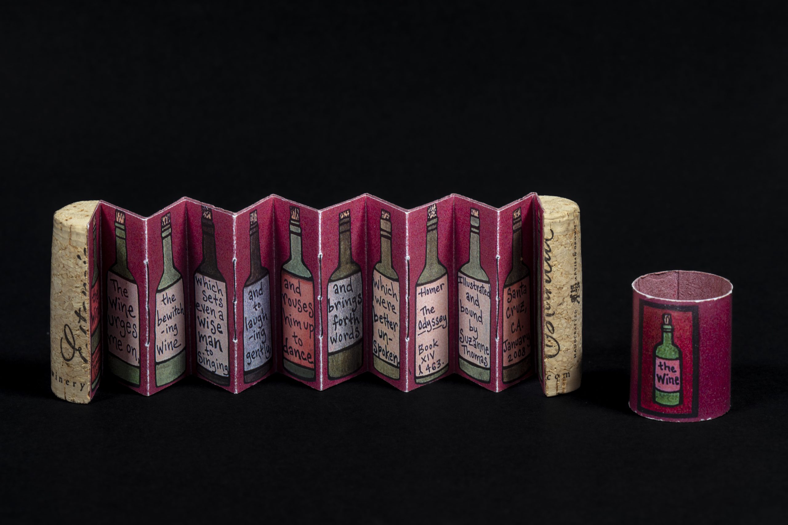 Art object of wine cork split open with panels of illustrated wine bottles.