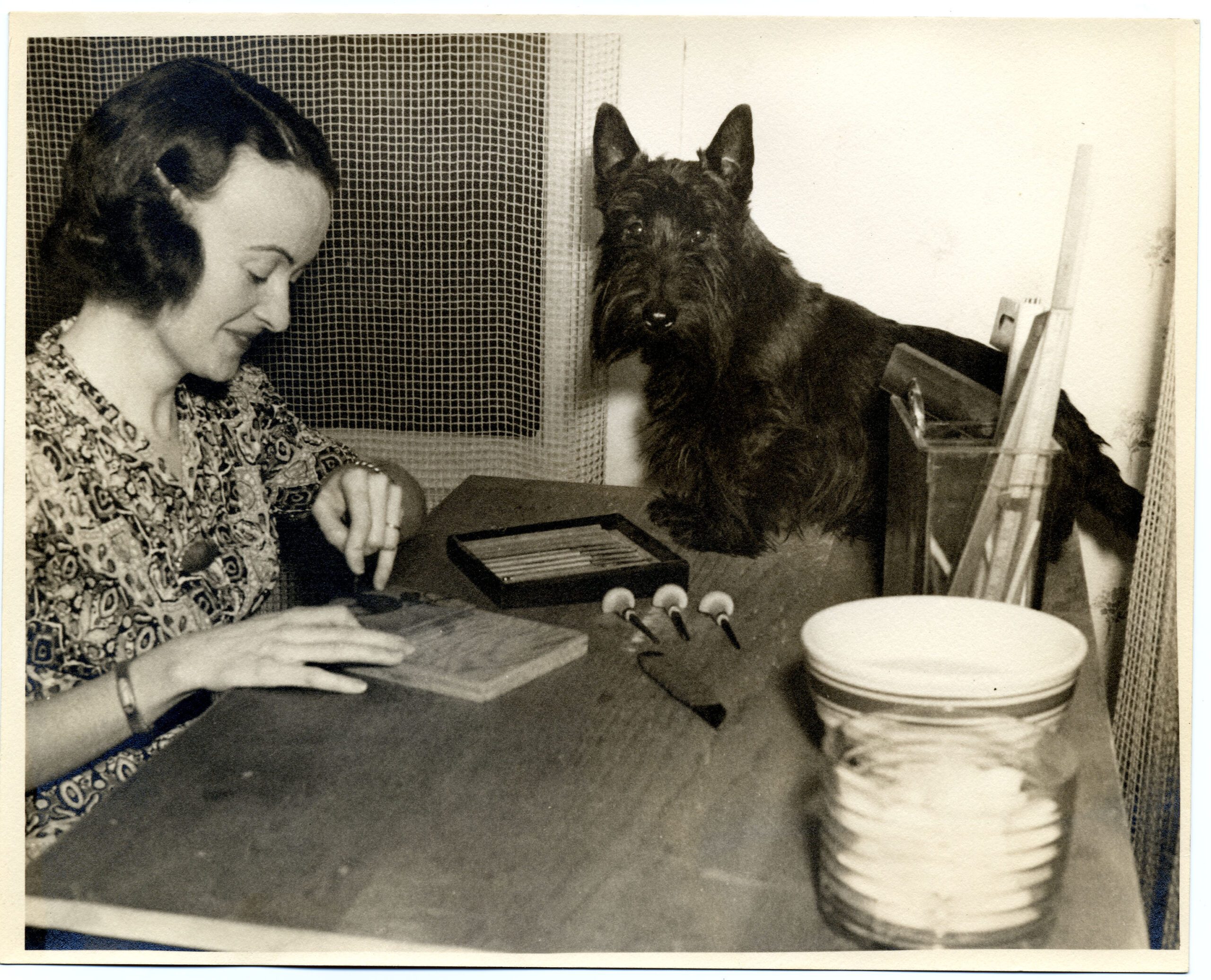 Margaret Harrison and Scotty dog with book tools