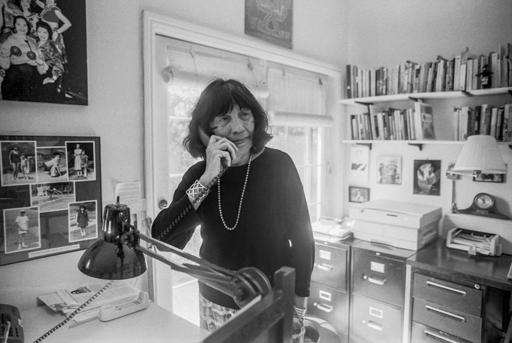 Betita Martinez on the phone in her office
