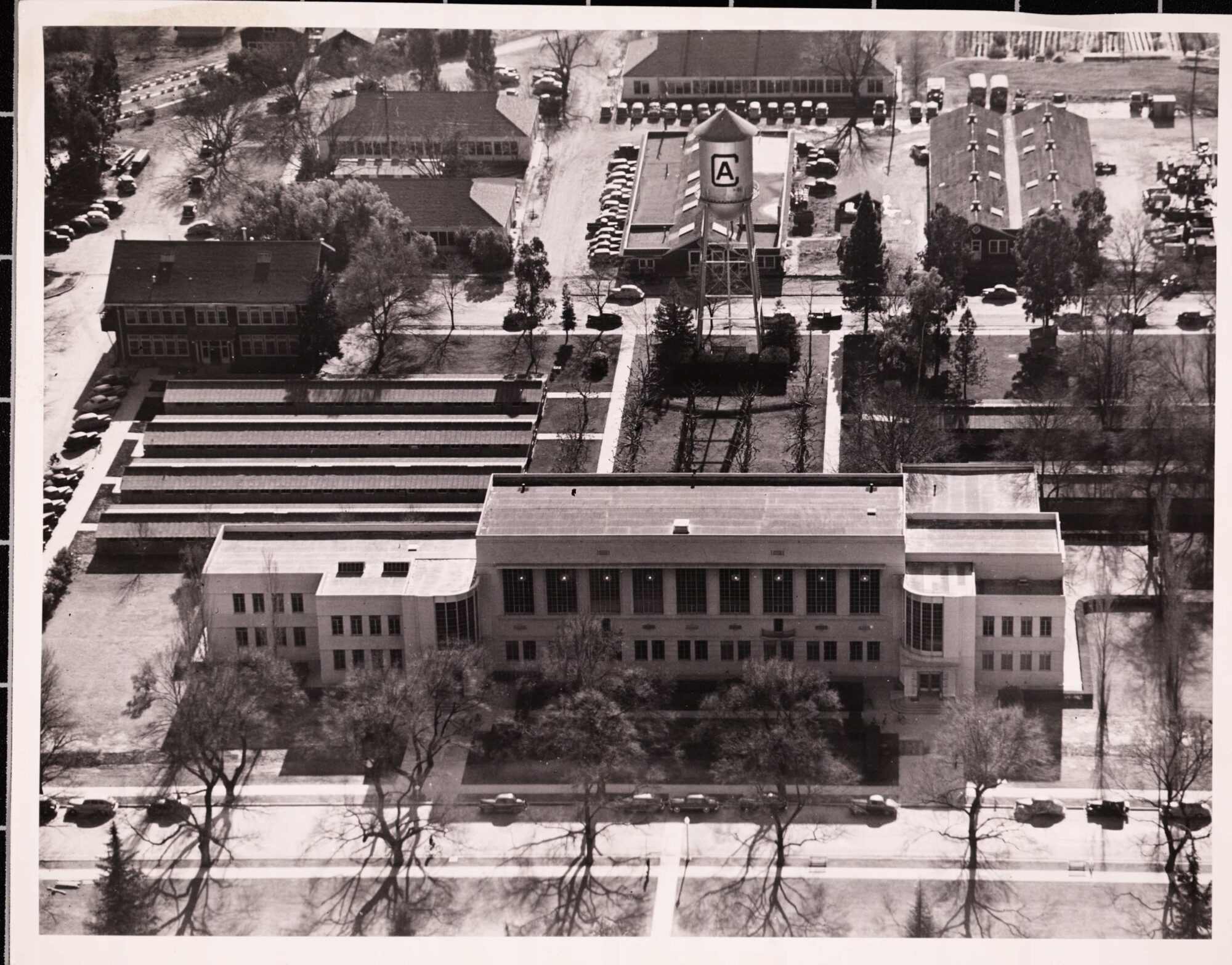 Aerial photograph of Shields Library with the water tower behind it
