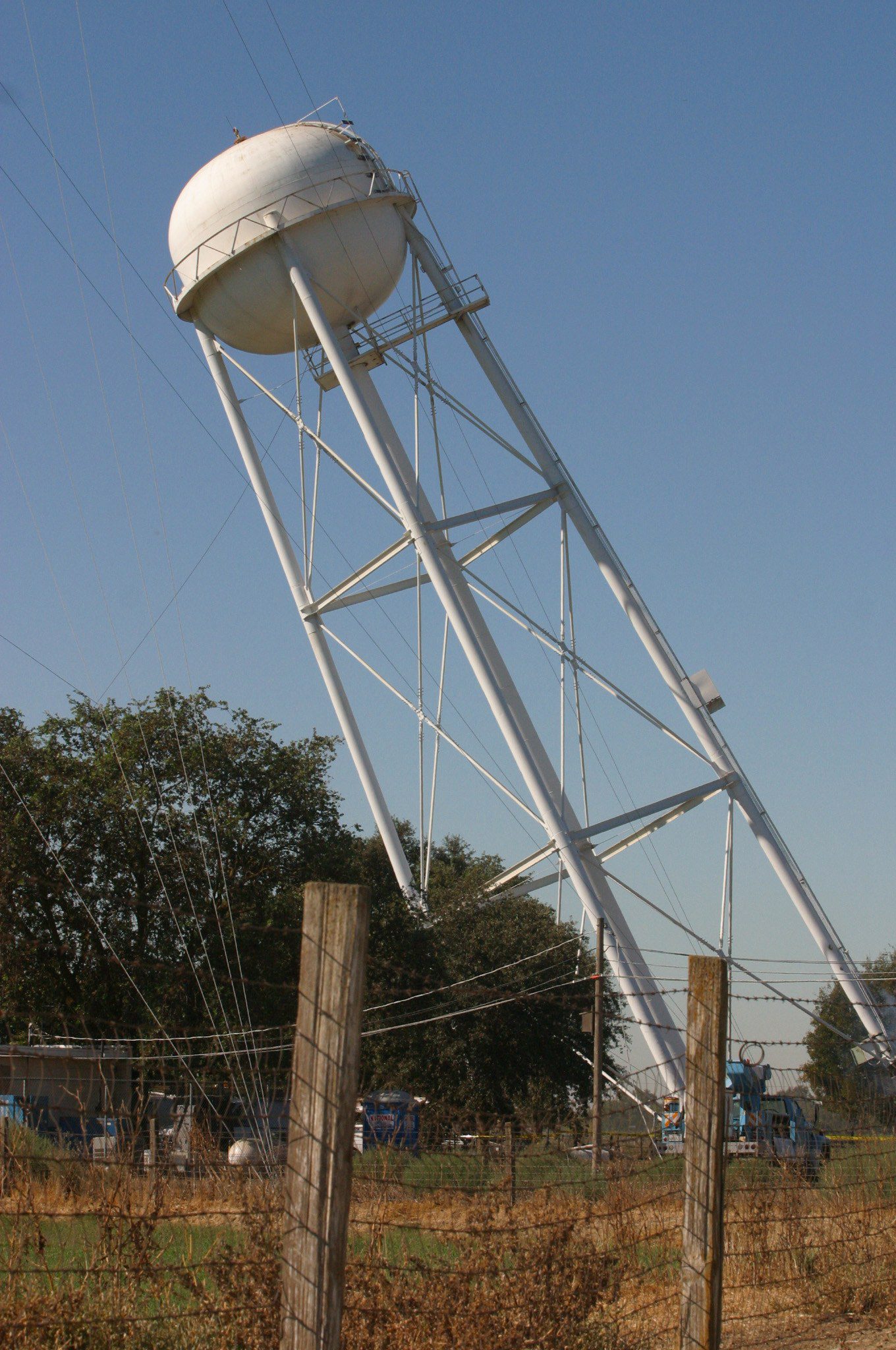 Photograph of water tower being pulled down