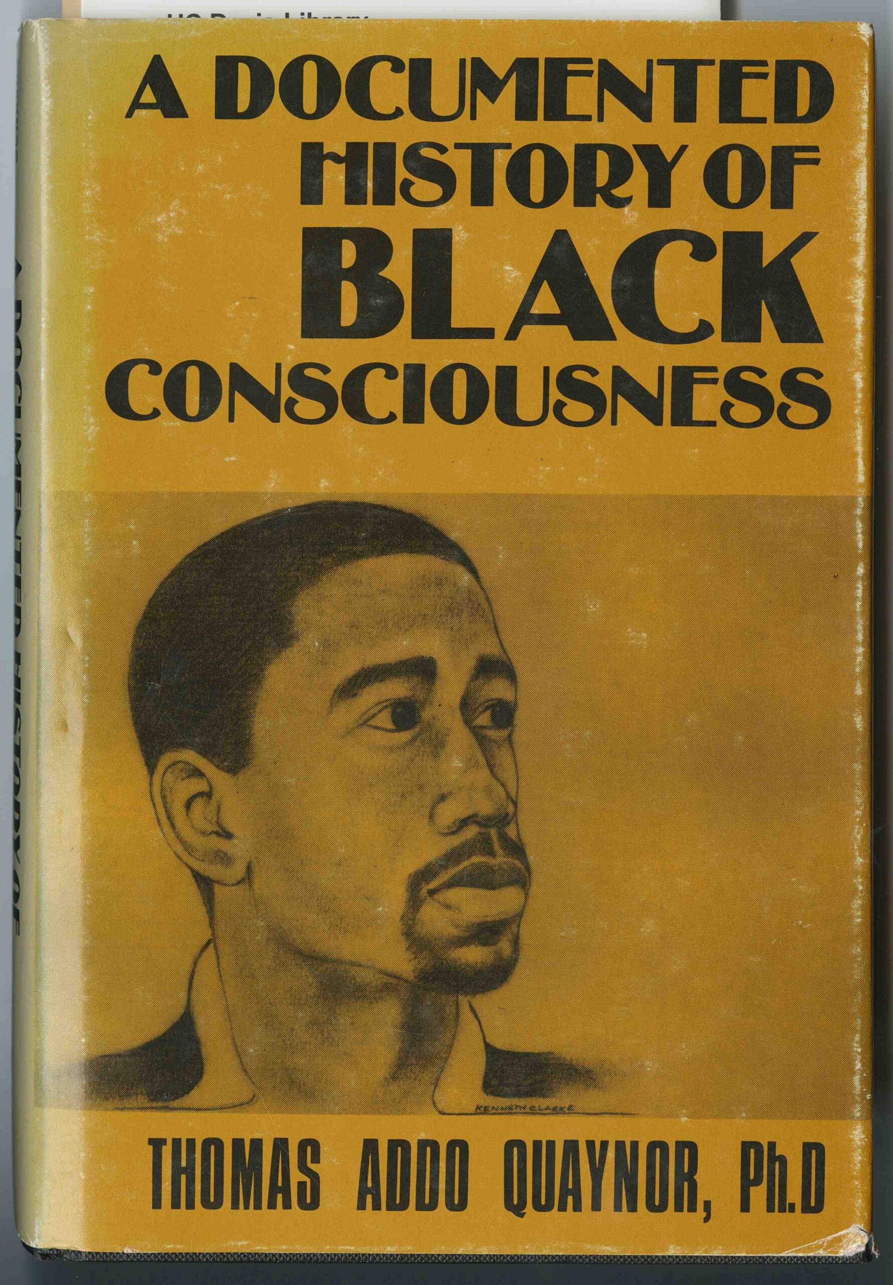 A yellow book cover with black text. An illustration of an African American male is in the center.