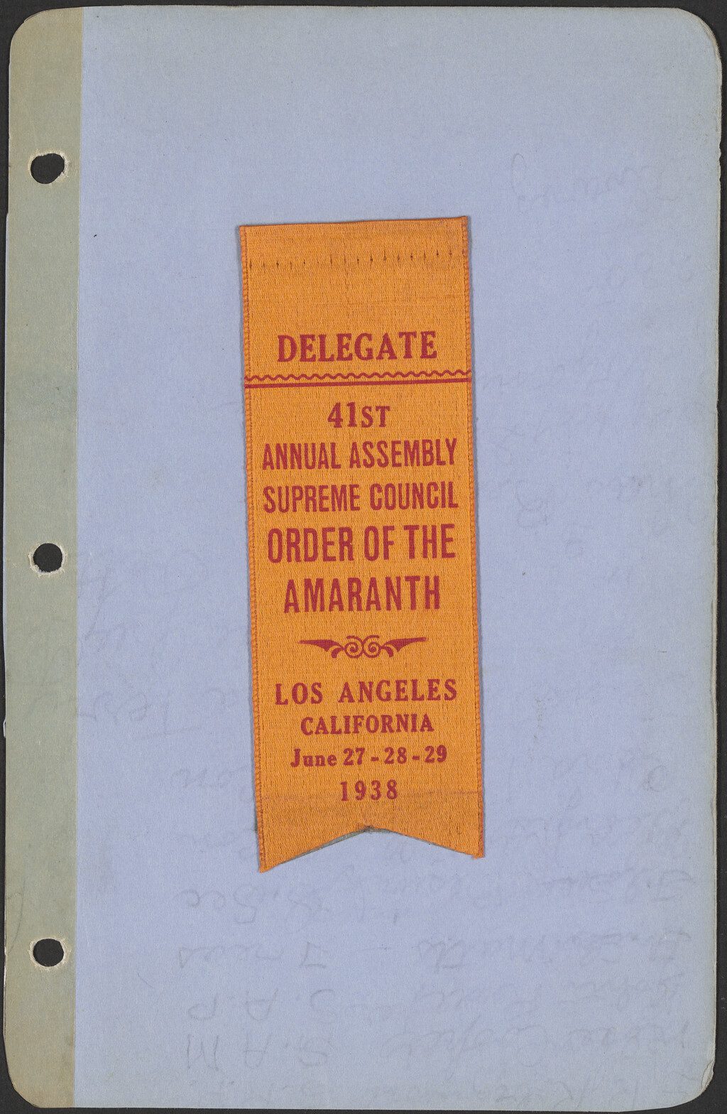 An orange ribbon glued onto a blue page.