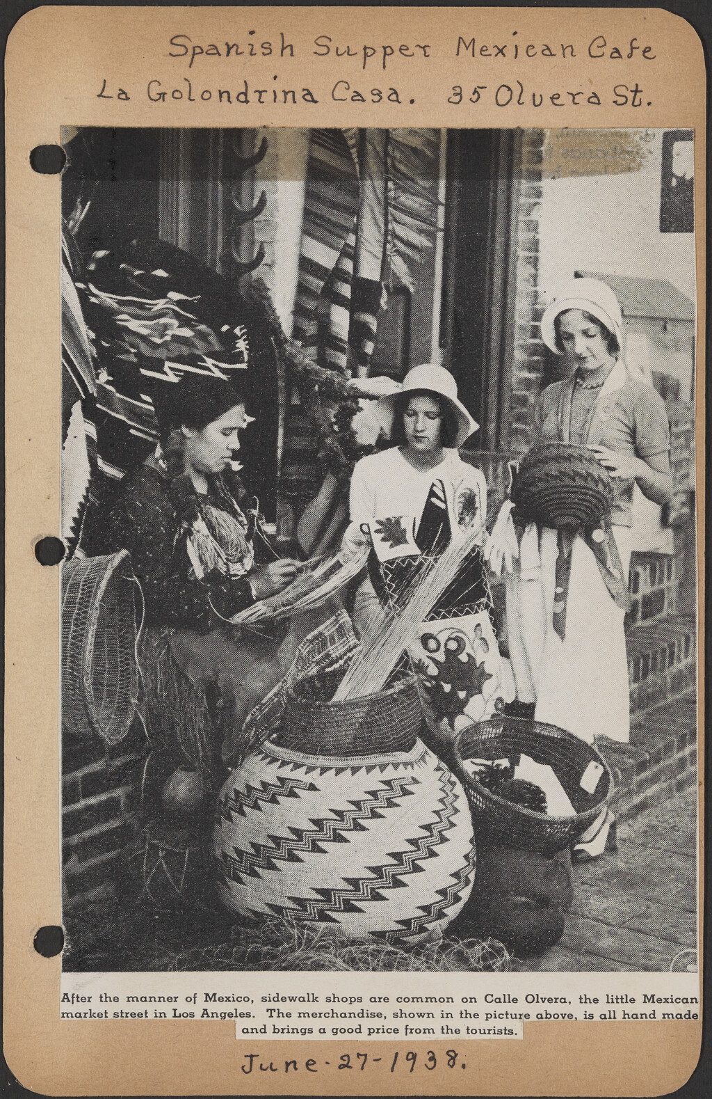 A clipping of two women looking at baskets while an indigenous woman weaves another.
