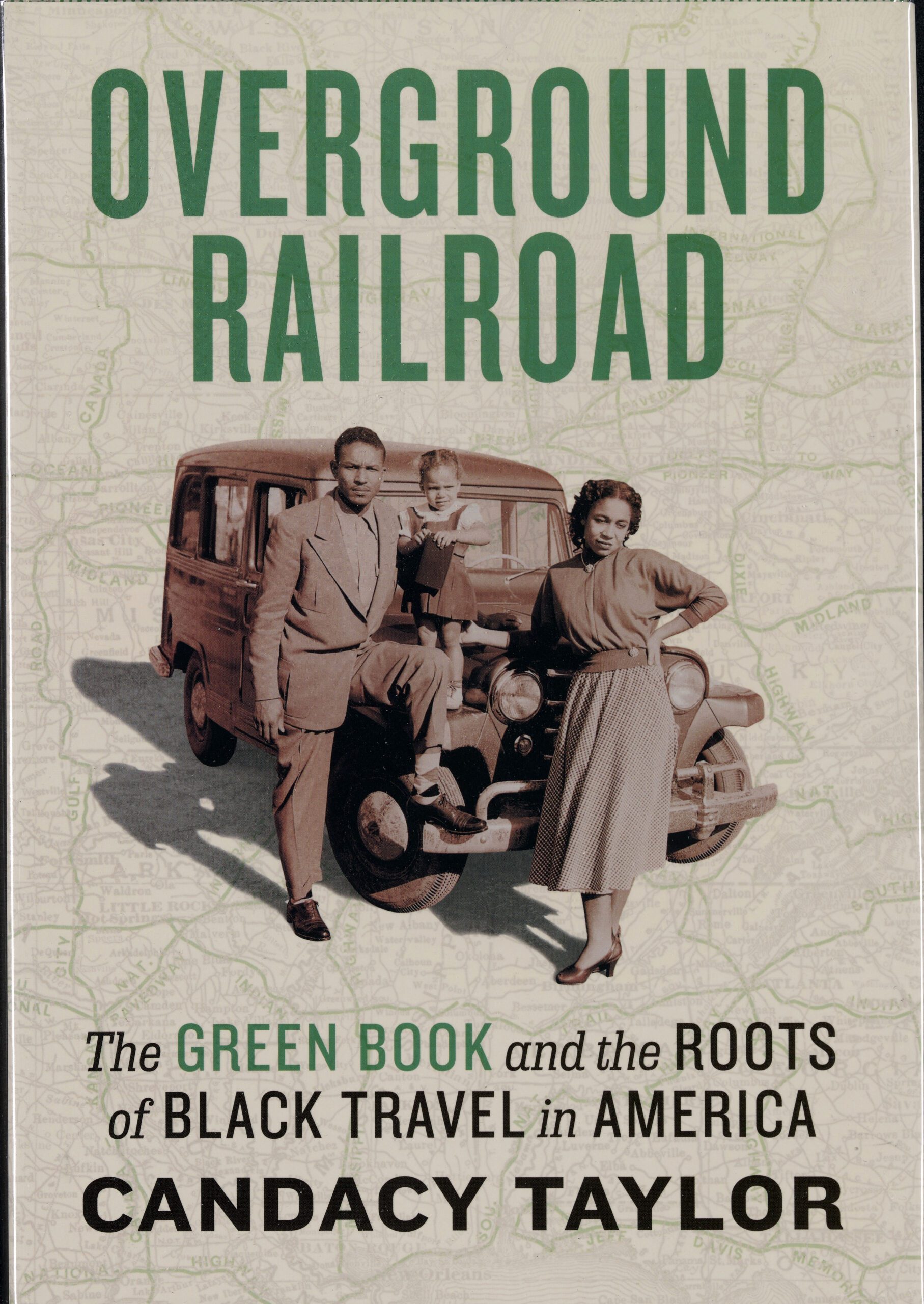 Book cover of Overground Railroad by Candacy Taylor, featuring a family posed with a vintage car against a map background.