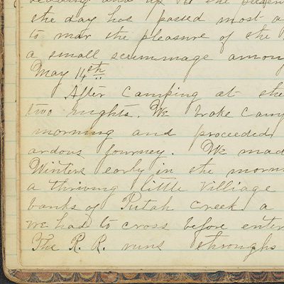 Small corner of handwritten diary page with cursive writing on lined paper
