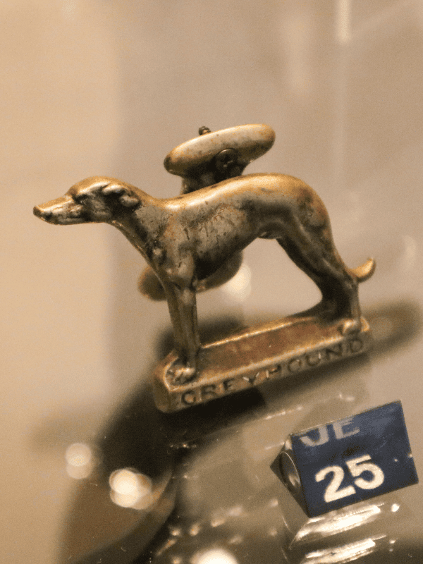 brass door knocker in the shape of a greyhound with base "Greyhound"